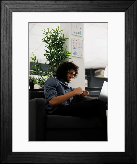 Framed Print : Happy executive manager celebrating successful product sales while working in start up business office