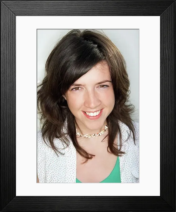 Framed Print : Young female smiling looking at camera Framed Print : Young female smiling looking at camera
