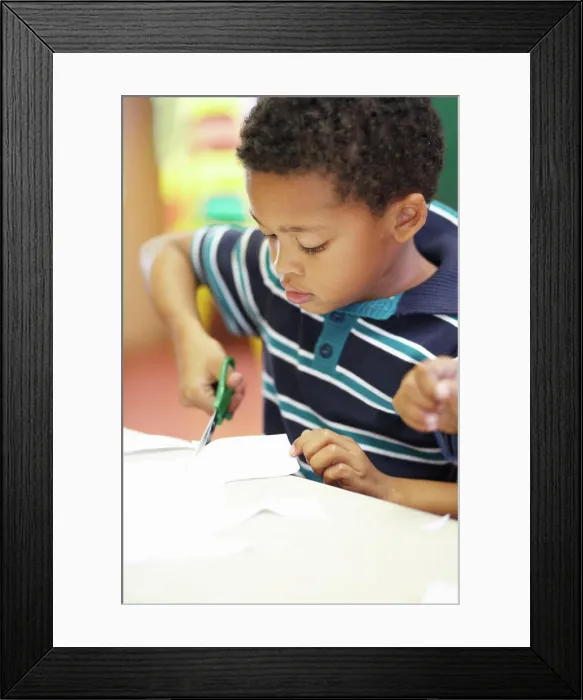 Framed Print : Boy, classroom and scissor for cutting paper with learning Framed Print : Boy, classroom and scissor for cutting paper with learning