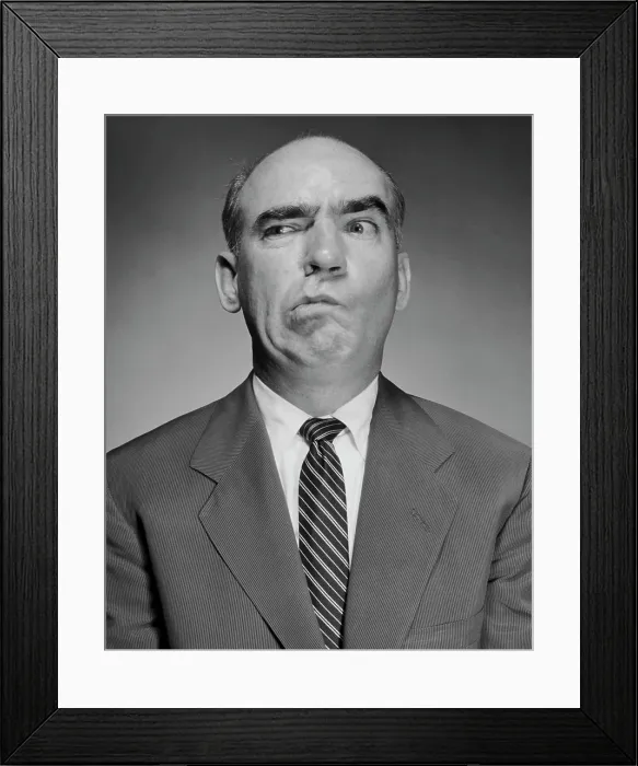 Framed Print : Close-up of a mature man making a face Framed Print : Close-up of a mature man making a face