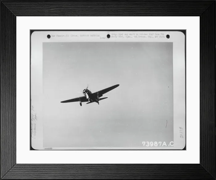Framed Print : Captured Japaneseanese 'Zero' In Flight Over An Airfield In China. February 1943 Framed Print : Captured Japaneseanese 'Zero' In Flight Over An Airfield In China. February 1943