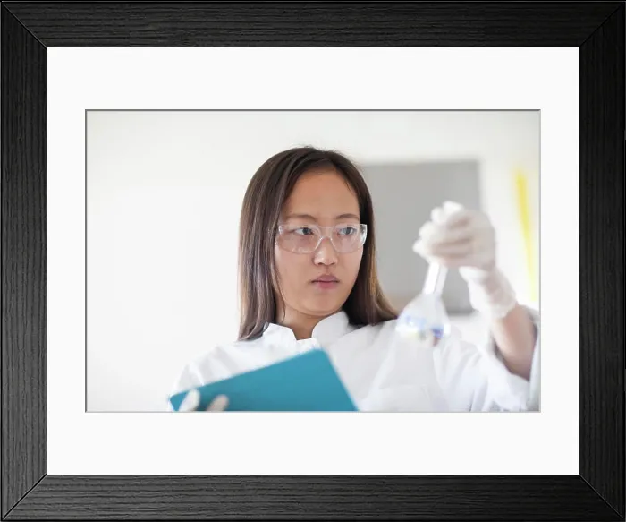Framed Print : scientist female with lab glasses and tablet in a lab Framed Print : scientist female with lab glasses and tablet in a lab