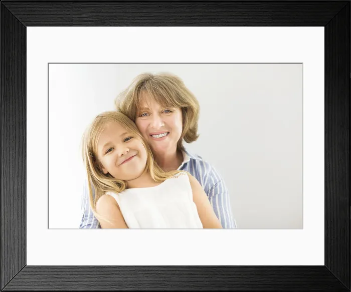 Framed Print : Mature woman embrace with young girl. Grandmother and girl Framed Print : Mature woman embrace with young girl. Grandmother and girl