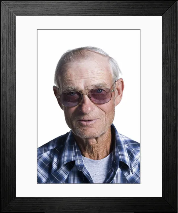 Framed Print : Older man in plaid shirt wearing sunglasses