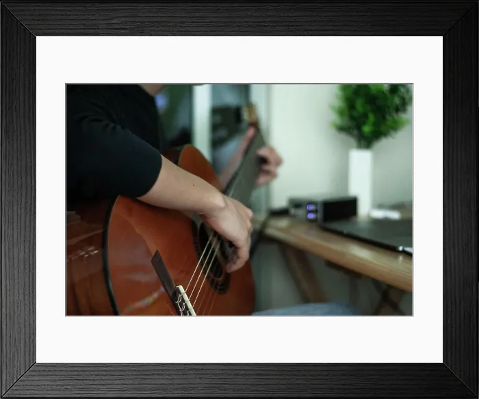 Framed Print : woman's hands playing acoustic guitar, close up Framed Print : woman's hands playing acoustic guitar, close up