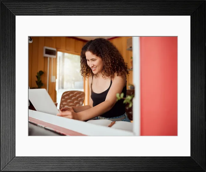 Framed Print : Freelance woman on a laptop working Framed Print : Freelance woman on a laptop working