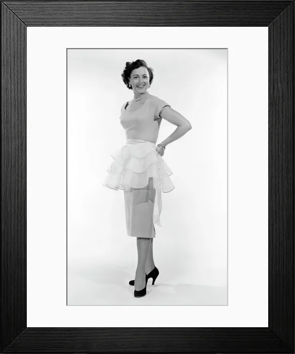 Framed Print : Portrait of mid adult woman trying on tutu