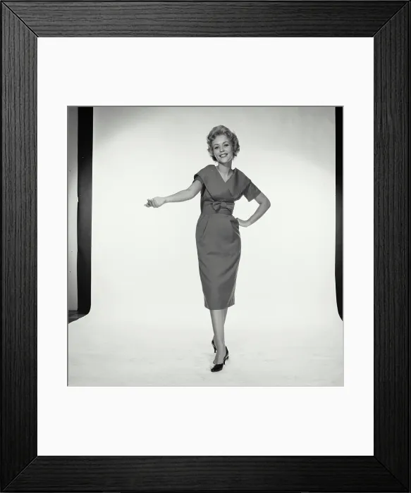 Framed Print : Vintage Photograph. Woman holds her hand out with palm facing up in studio portrait