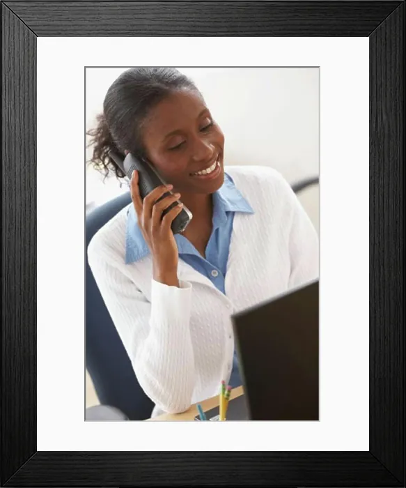Framed Print : Close-up of a businesswoman talking on the phone