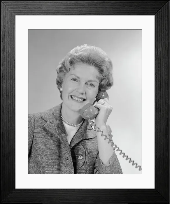 Framed Print : 1960S Portrait Smiling Mature Woman Talking On Telephone Framed Print : 1960S Portrait Smiling Mature Woman Talking On Telephone
