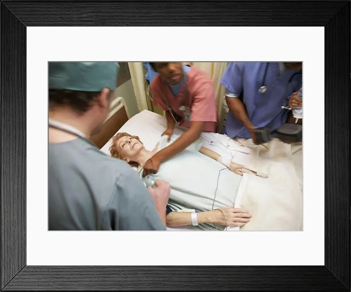 Framed Print : Medical Team Treating Patient Framed Print : Medical Team Treating Patient