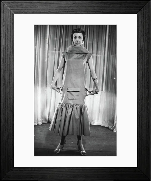 Framed Print : The 'Elongated Look' In The New Spring Collections -- A novel summer frock or beach dress featuring the new 'elongated Framed Print : The 'Elongated Look' In The New Spring Collections -- A novel summer frock or beach dress featuring the new 'elongated