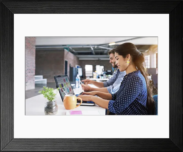Framed Print : Teamwork, office and woman at typing at desk with laptop Framed Print : Teamwork, office and woman at typing at desk with laptop