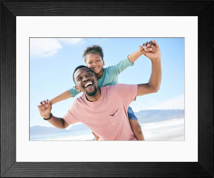 Framed Print : Beach, black man with child on piggy back and smile on playful family holiday in Australia with freedom and fun Framed Print : Beach, black man with child on piggy back and smile on playful family holiday in Australia with freedom and fun