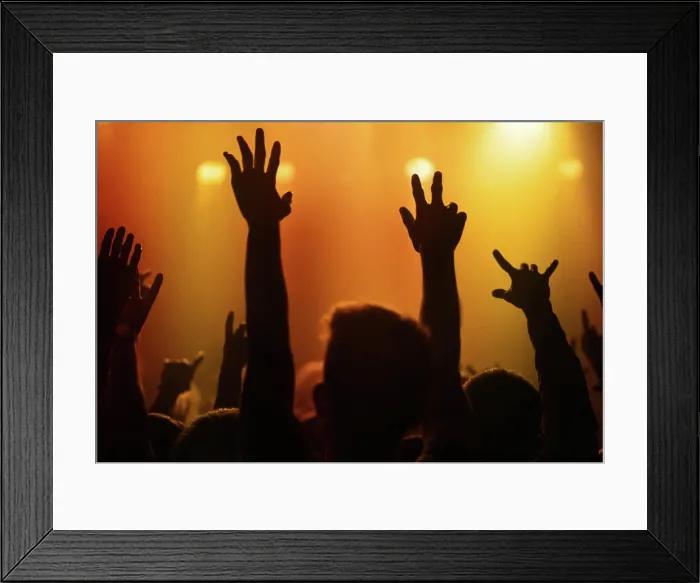 Framed Print : Orange lights, hands of people at concert or music festival dancing with energy in silhouette at live event Framed Print : Orange lights, hands of people at concert or music festival dancing with energy in silhouette at live event
