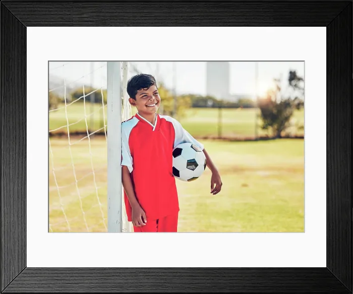 Framed Print : Soccer player, field and child with happy game Framed Print : Soccer player, field and child with happy game