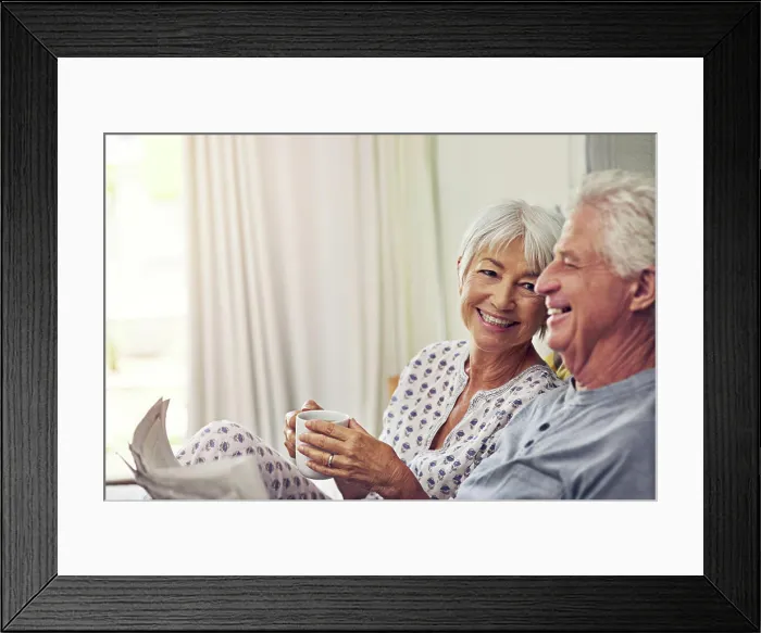 Framed Print : Coffee, newspaper and a senior couple in bed Framed Print : Coffee, newspaper and a senior couple in bed