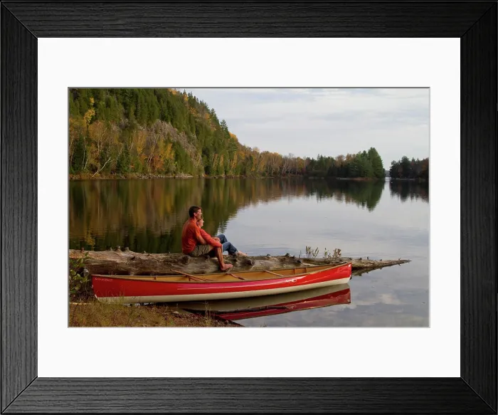 Framed Print : Young couple enjoy quite evening beside canoe on Oxtongue Lake, Muskoka, Ontario, Canada Framed Print : Young couple enjoy quite evening beside canoe on Oxtongue Lake, Muskoka, Ontario, Canada
