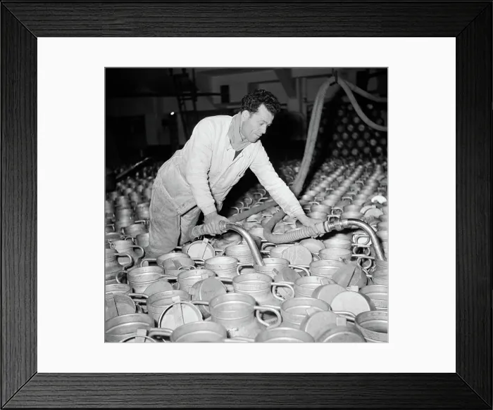 Framed Print : Poll photo collection. Report Paris. Milk factory: Man fills the milk buses. 1950. France, Paris Framed Print : Poll photo collection. Report Paris. Milk factory: Man fills the milk buses. 1950. France, Paris