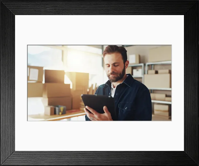 Framed Print : Man, typing and tablet with boxes for distribution of online orders