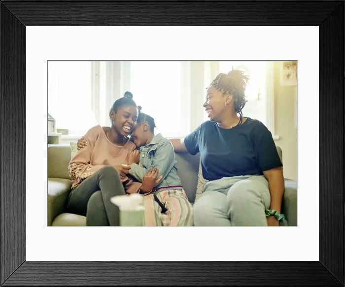 Framed Print : Happy, laughing and smile with mother and daughter on sofa for bonding