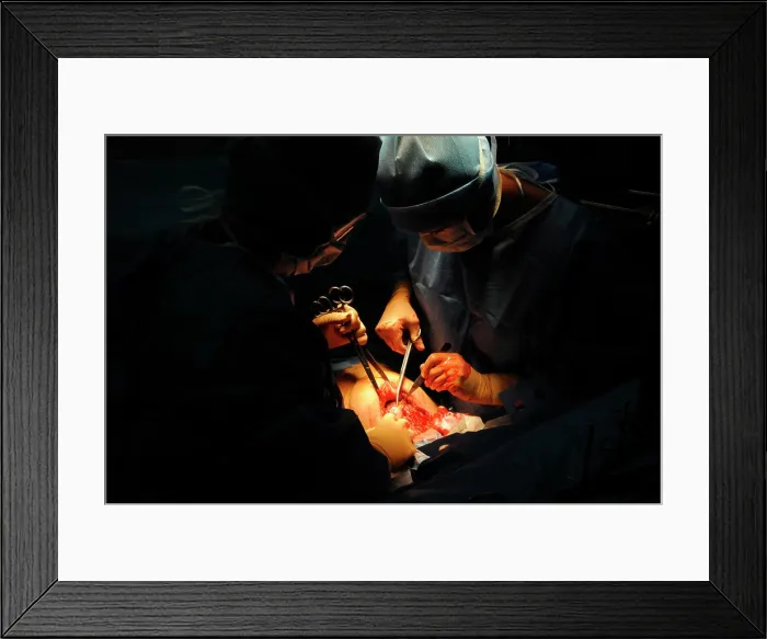 Framed Print : Cesarean delivery of a woman pregnant with twins Framed Print : Cesarean delivery of a woman pregnant with twins