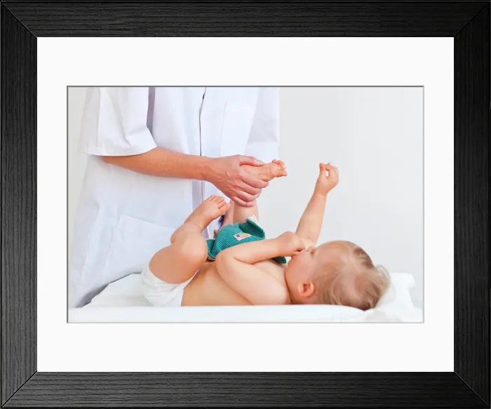 Framed Print : 17 months old baby receiving foot massage Framed Print : 17 months old baby receiving foot massage