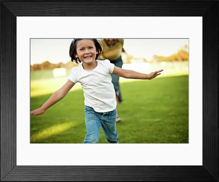 Framed Print : Girl and grandmother running through park Framed Print : Girl and grandmother running through park