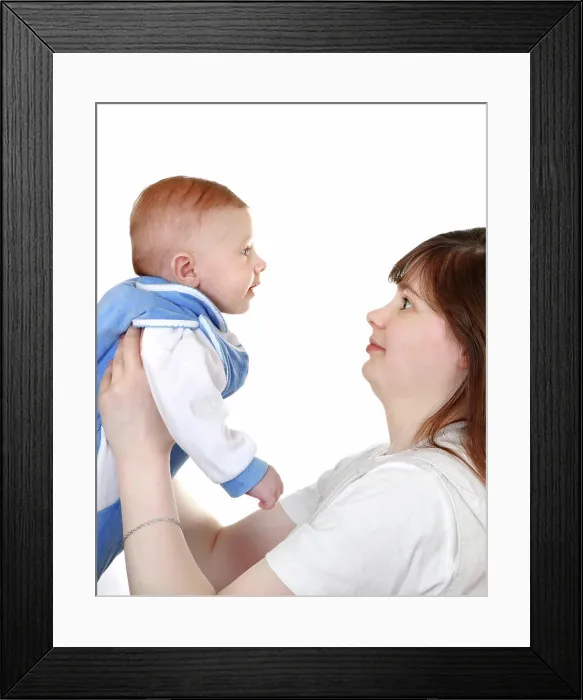 Framed Print : Young Mother and Baby Side view of Young Mother and beautiful Baby Boy Isolated on the White Background