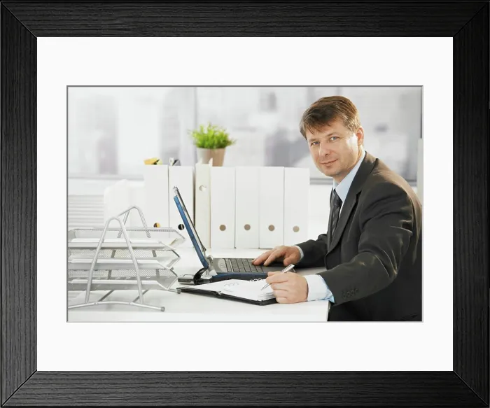 Framed Print : Businessman using laptop computer Businessman working in office Framed Print : Businessman using laptop computer Businessman working in office