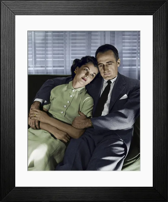 Framed Print : Close-up of mid adult couple sitting on couch Framed Print : Close-up of mid adult couple sitting on couch