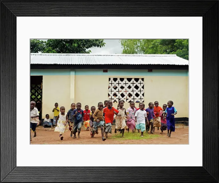 Framed Print : Malawi, Mzimba district, Chilumba Community Based Childcare Centre (CBCC). Children running in front of building Framed Print : Malawi, Mzimba district, Chilumba Community Based Childcare Centre (CBCC). Children running in front of building