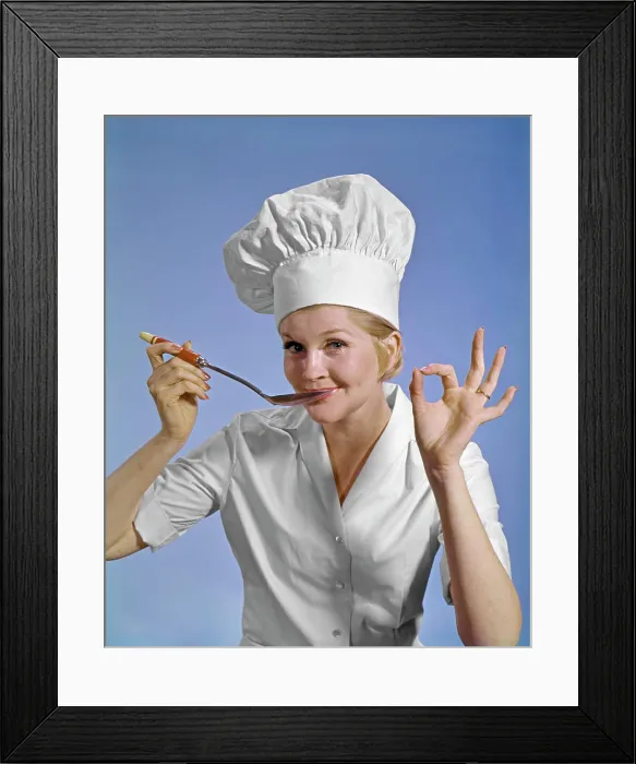 Framed Print : 1960S WOMAN CHEF WEARING TOQUE LOOKING AT CAMERA TASTING FOOD MAKING OKAY SIGN SMILING