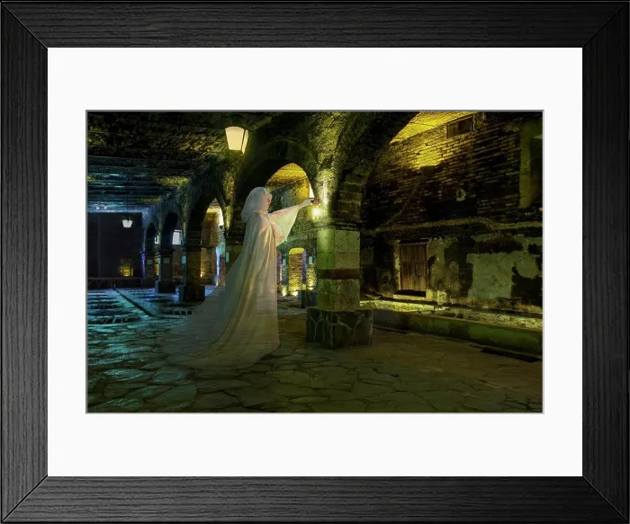 Framed Print : Female ghost with lantern, dressed all in white standing in a cavernous stone basement Framed Print : Female ghost with lantern, dressed all in white standing in a cavernous stone basement