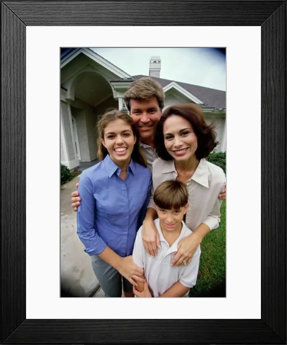 Framed Print : Mature couple with their son and daughter smiling
