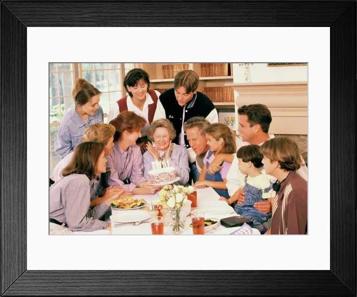 Framed Print : Family celebrating a birthday party Framed Print : Family celebrating a birthday party