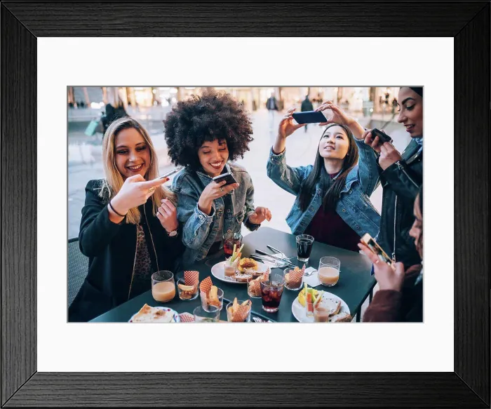Framed Print : Friends taking photos of their food and drinks at outdoor cafe, Milan, Italy Framed Print : Friends taking photos of their food and drinks at outdoor cafe, Milan, Italy