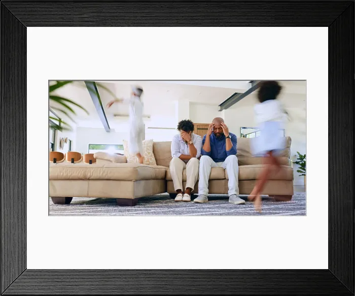 Framed Print : Children running and parents on sofa with stress Framed Print : Children running and parents on sofa with stress