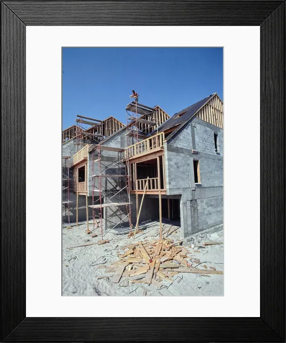 Framed Print : Construction progress on new residential homes under clear blue skies Framed Print : Construction progress on new residential homes under clear blue skies