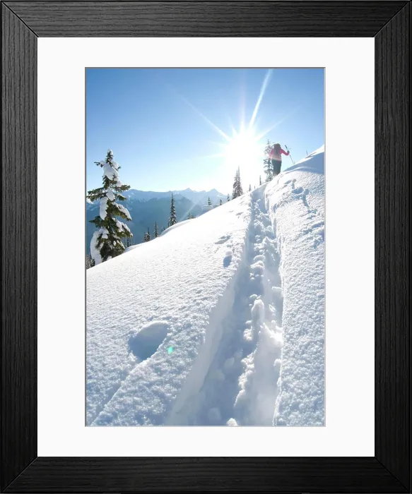 Framed Print : A young woman skier climbs up Corbin Pass near Revelstoke, British Columbia Framed Print : A young woman skier climbs up Corbin Pass near Revelstoke, British Columbia