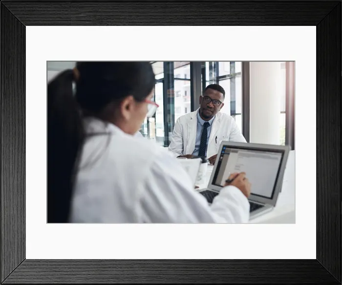 Framed Print : Doctors, meeting and research together on laptop for health Framed Print : Doctors, meeting and research together on laptop for health