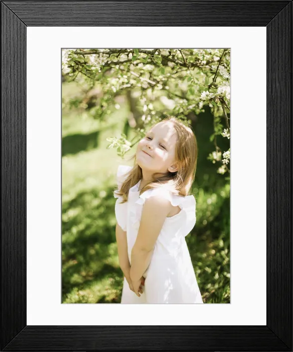 Framed Print : Portrait of little toddler girl in white romantic dress in blossoming garden in spring Framed Print : Portrait of little toddler girl in white romantic dress in blossoming garden in spring