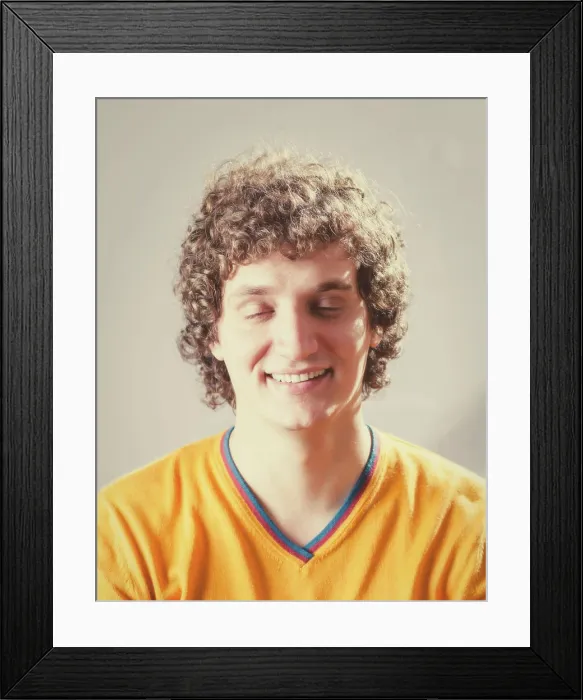 Framed Print : Detailed portrait of a young caucasian guy with curly hair Closed eyes portrait of a young caucasian guy with curly
