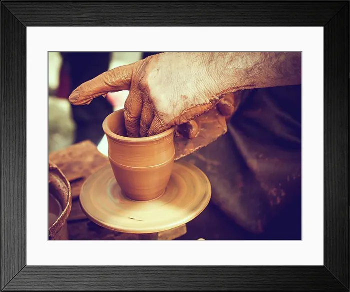 Framed Print : Potter`s hands shaping up the clay of the pot Framed Print : Potter`s hands shaping up the clay of the pot