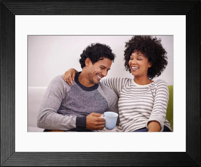 Framed Print : Couple, couch and hug for care and coffee in home Framed Print : Couple, couch and hug for care and coffee in home