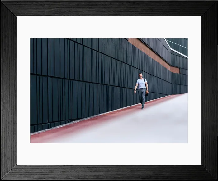 Framed Print : Mature bearded businessman with shoulder bag in the city