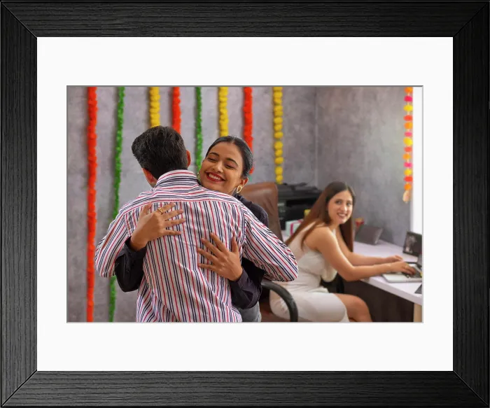 Framed Print : Employee hugging each other in office during Diwali celebration Framed Print : Employee hugging each other in office during Diwali celebration