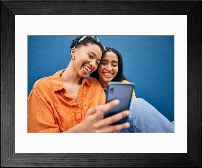 Framed Print : Phone, happy and women in city on blue background for social media Framed Print : Phone, happy and women in city on blue background for social media