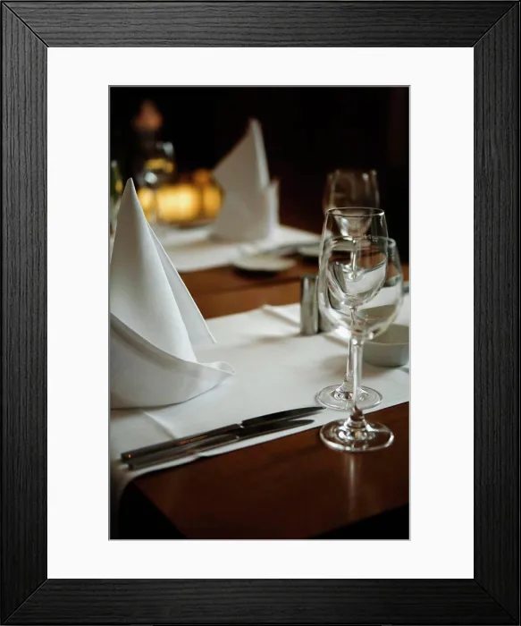 Framed Print : A table set for dinner in a restaurant Framed Print : A table set for dinner in a restaurant