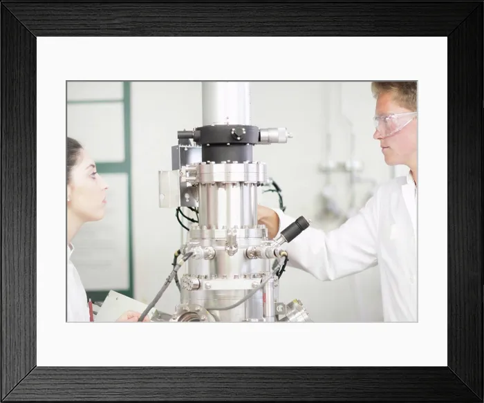 Framed Print : Scientists using equipment in lab Framed Print : Scientists using equipment in lab